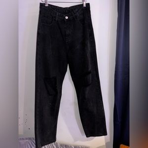 Baggy ripped black jeans.